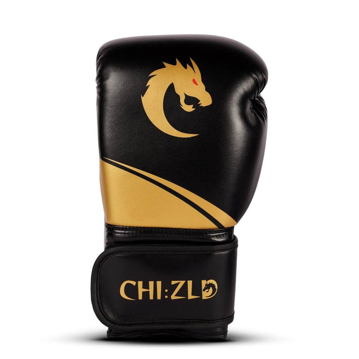 Front view of a single glove highlighting full-size gold dragon graphic above sweeping gold panel and CHIZLD word-mark on hook-and-loop closure.
