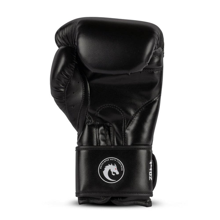 Rear (palm) view: smooth black synthetic-leather with stitched grip bar, ventilated finger gussets, and circular white dragon badge on wrist cuff (12 oz).