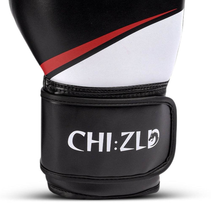 Close-up of outer wrist area showing white/red swoosh detail and raised CHIZLD logo printed on black strap.