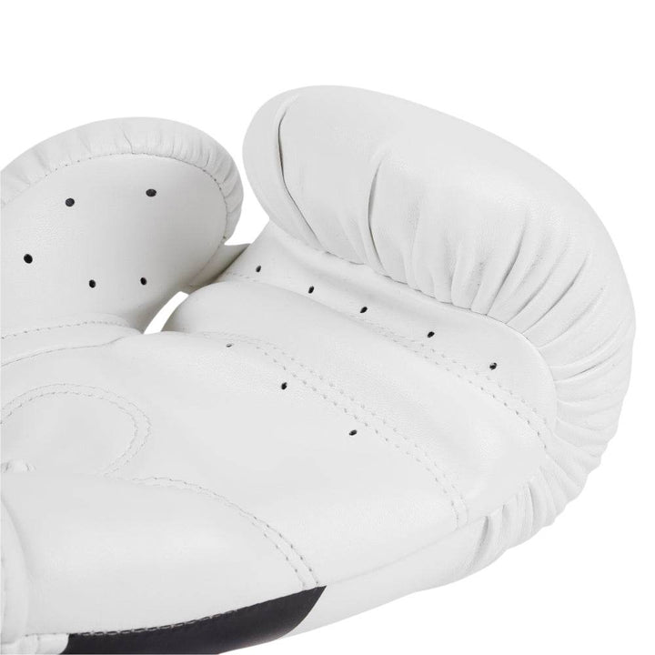 Interior palm shot displaying curved grip bar, perforations for airflow, and dense ergonomic padding along thumb seam.