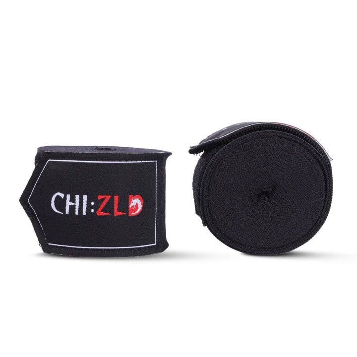 Two 4.5 m CHIZLD Impact handwraps side-by-side: one tightly rolled black wrap, one folded wrap showing black hook-and-loop patch with white “CHI:ZLD” logo and white trim.