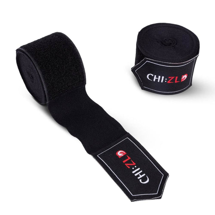 Twin wraps: one fully rolled, one half-unrolled to display black stretch fabric and oversized black Velcro closure, both sporting CHIZLD logo patches.