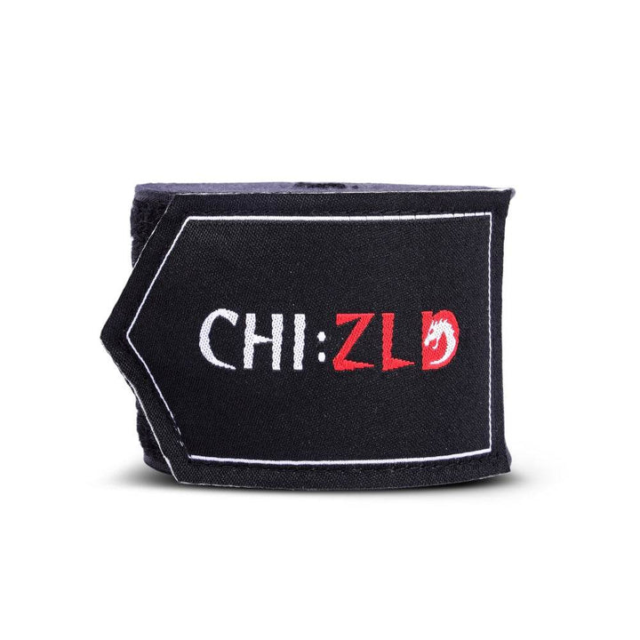 Upright roll with visible logo patch wrapped around core of bright black handwrap.