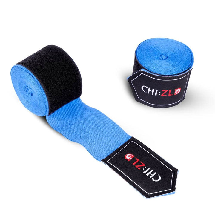 Pair of wraps on white background: one full roll, one half-unrolled to show bright blue elastic band and oversized black Velcro strip.