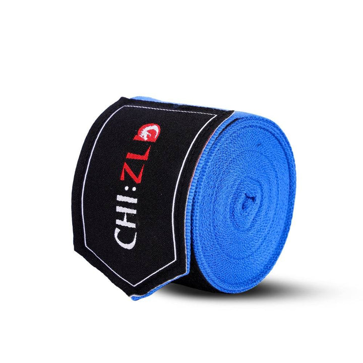 Upright roll wrapped with black logo patch, highlighting circular layers of tightly wound blue fabric.