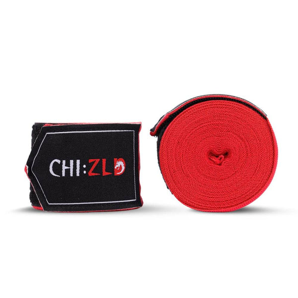 Two 4.5 m CHIZLD Impact handwraps side-by-side: one tightly rolled red wrap, one folded wrap showing black hook-and-loop patch with white “CHI:ZLD” logo and red trim.