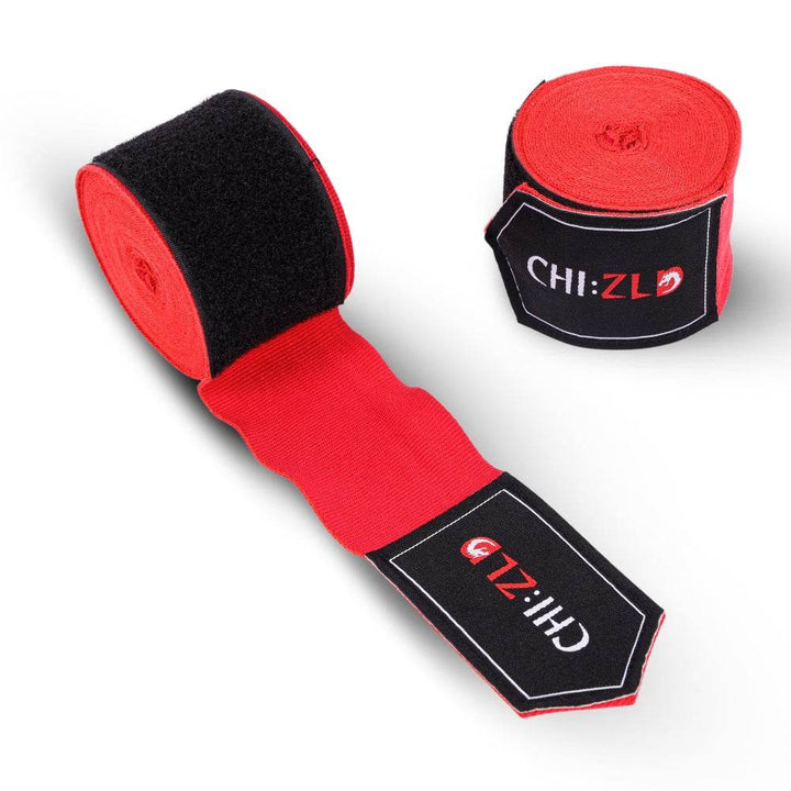 Twin wraps: one fully rolled, one half-unrolled to display red stretch fabric and oversized black Velcro closure, both sporting CHIZLD logo patches.