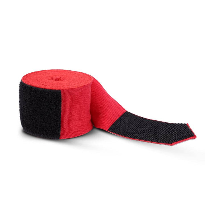 Red wrap unspooling from roll, black Velcro segment visible on exterior for secure closure.