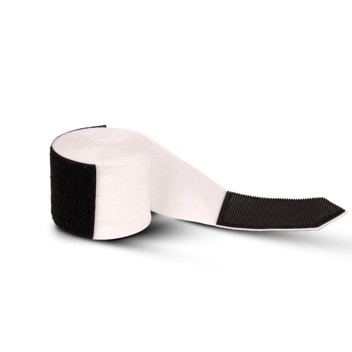 Rolled white wrap unspooling, revealing white band and black Velcro tip for secure fastening.