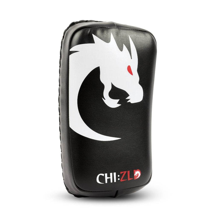 Single pad three-quarter view highlighting curved, high-density striking surface with dragon logo on black synthetic leather.