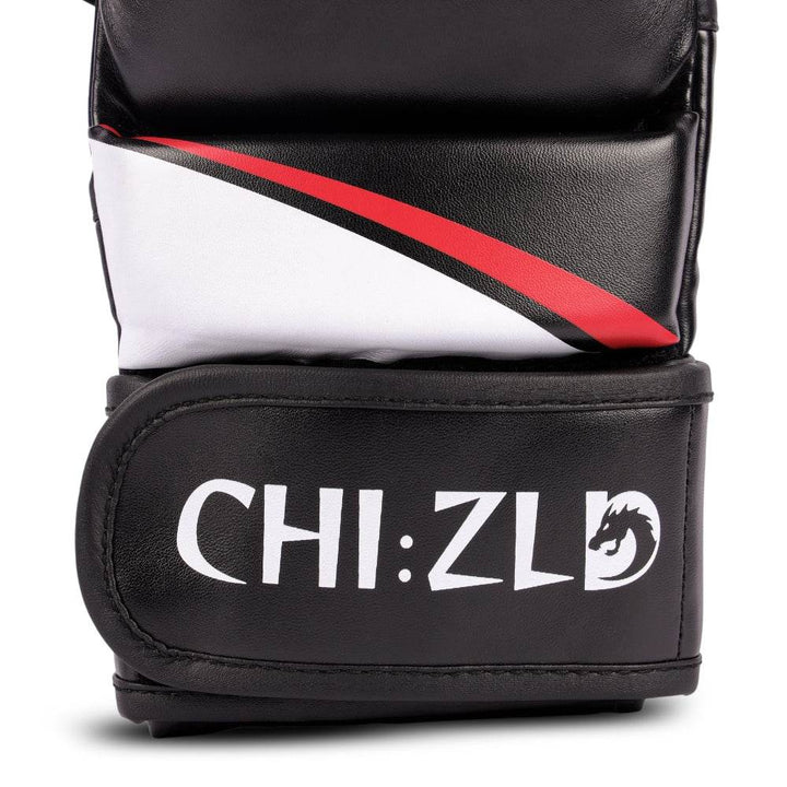 Detail of wrist closure showing curved red/white swoosh above wide black hook-and-loop strap printed with CHIZLD word-mark.