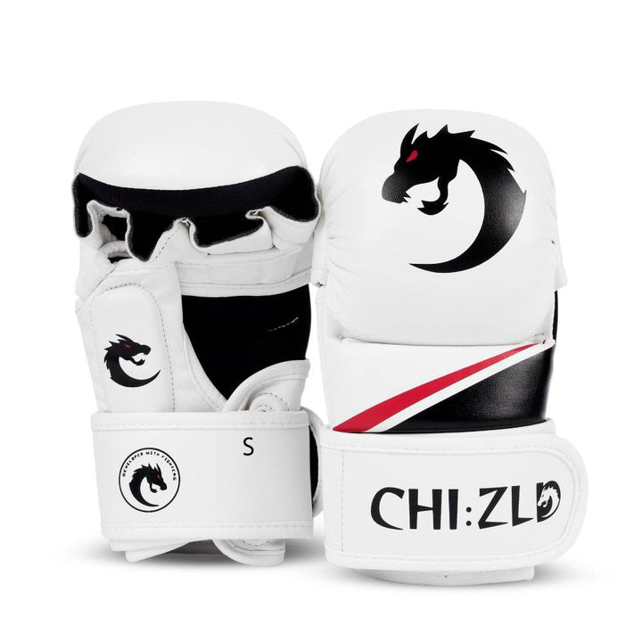 Front and rear view of paired white MMA-style sparring gloves with padded knuckle shell, black dragon-head logo, and diagonal red/black accent stripe.