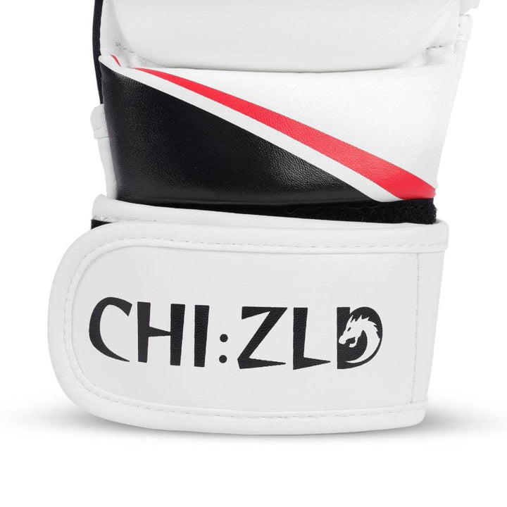 Detail of wrist closure showing curved red/black swoosh above wide white hook-and-loop strap printed with CHIZLD word-mark.