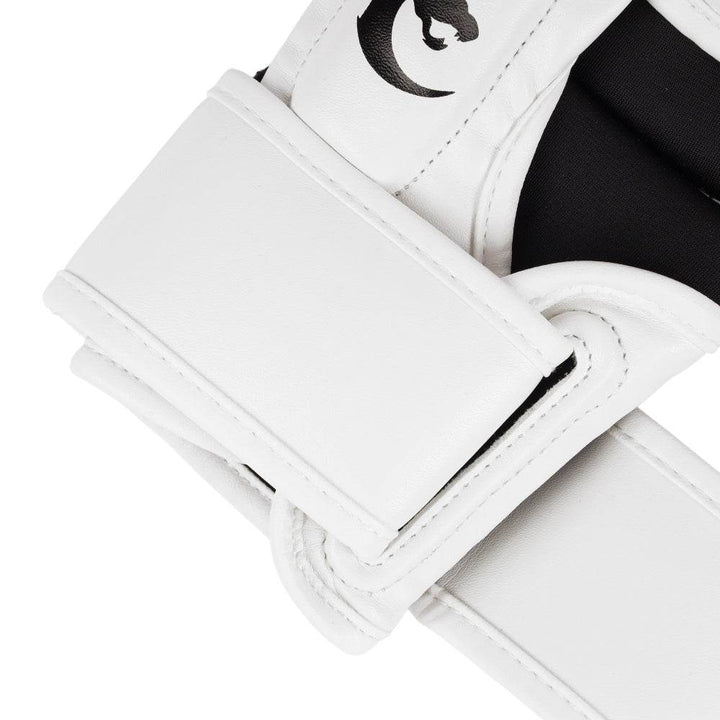 Macro of plain strap end, showing clean white synthetic leather and reinforced stitching along the edges.