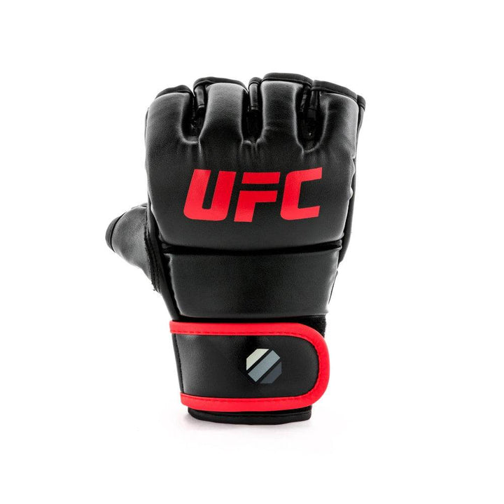 Knuckle-side single – Head-on shot of closed-fist glove highlighting three-panel knuckle padding, vivid red logo and red-piped hook-and-loop strap tab.
