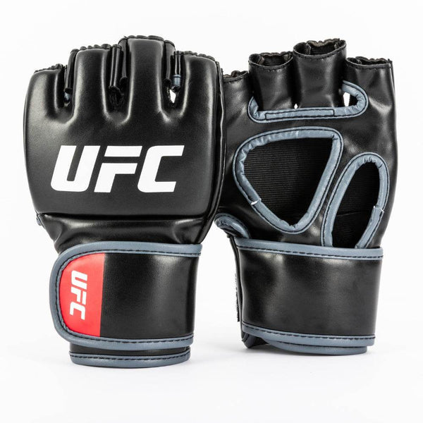 Front-and-back view: matte-black synthetic leather with bright red “UFC” on knuckle side, open-palm design on reverse; hook-and-loop wrist straps edged in red with tonal octagon icon.