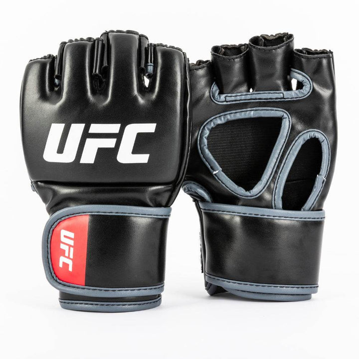 Front-and-back view: matte-black synthetic leather with bright red “UFC” on knuckle side, open-palm design on reverse; hook-and-loop wrist straps edged in red with tonal octagon icon.