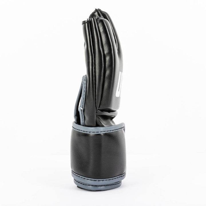 Slender view highlighting layered knuckle padding, sculpted thumb sleeve and tall black wrist support.