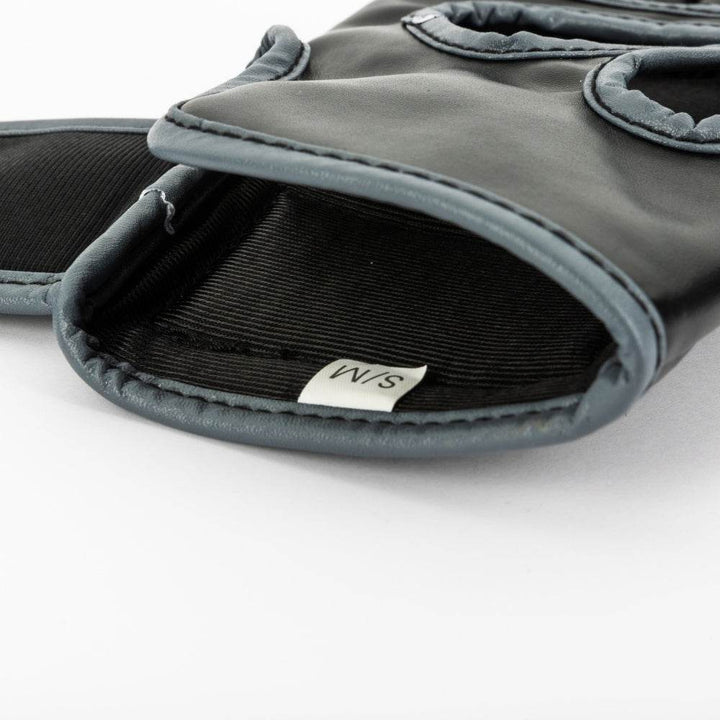Glove laid open to show twin heart-shaped cut-outs and smooth interior lining for grip flexibility.