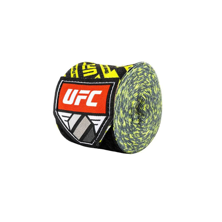One tightly rolled hand wrap in the same black-and-yellow motif, shown at an angle to highlight the multicolour weave and the red UFC shield label.