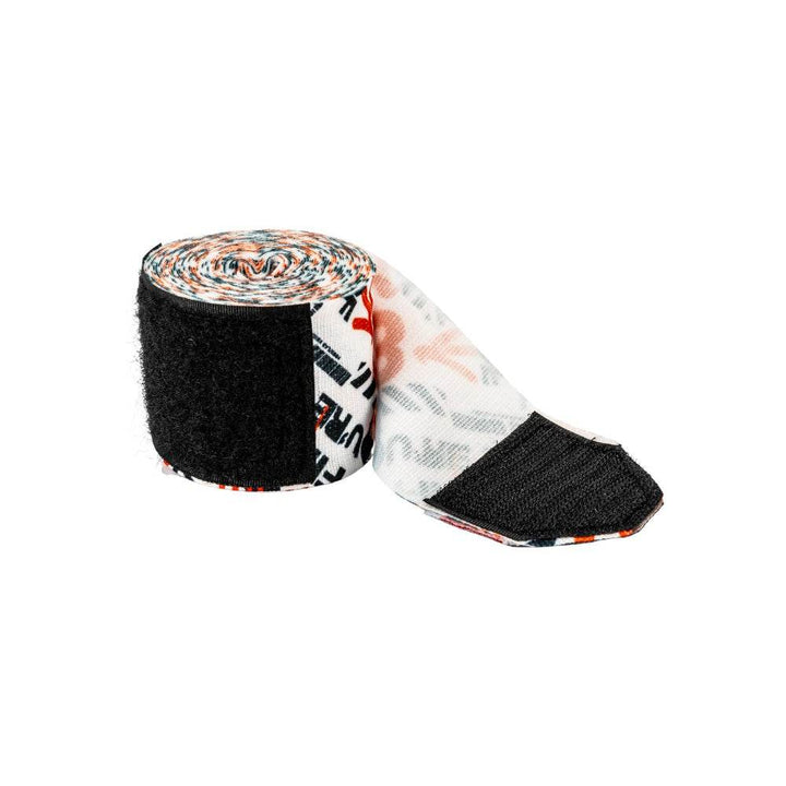 Graffiti-pattern hand wrap with a length unrolled to reveal the inner white print and black hook-and-loop closure end.