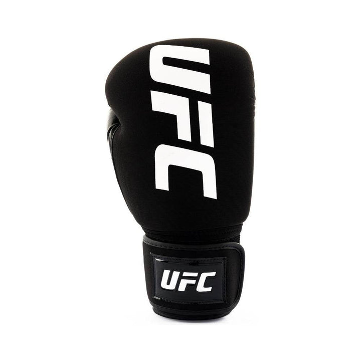 Straight front view of a single black bag glove featuring bold white vertical “UFC” lettering and a glossy black hook-and-loop wrist patch.