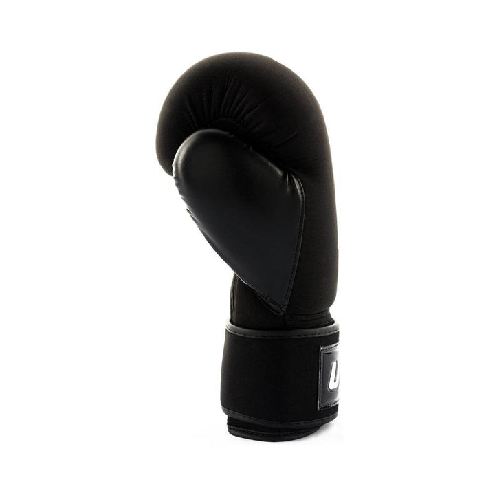 Left-side profile highlighting the contoured black synthetic-leather palm and ergonomic thumb support against the matte black fabric shell.