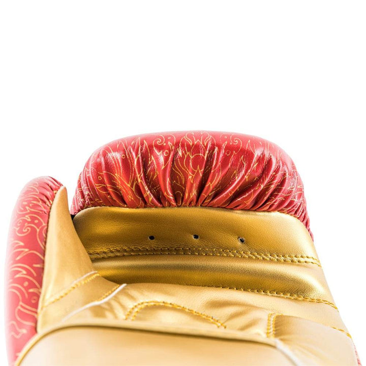 Palm-side view of a red UFC Thai Naga boxing glove revealing the ventilated black mesh palm panel and padded thumb channel.