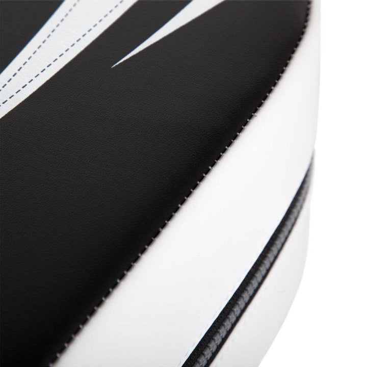 Macro view of white and black stitching detail on corner curve of the Venum Giant Kick Shield.