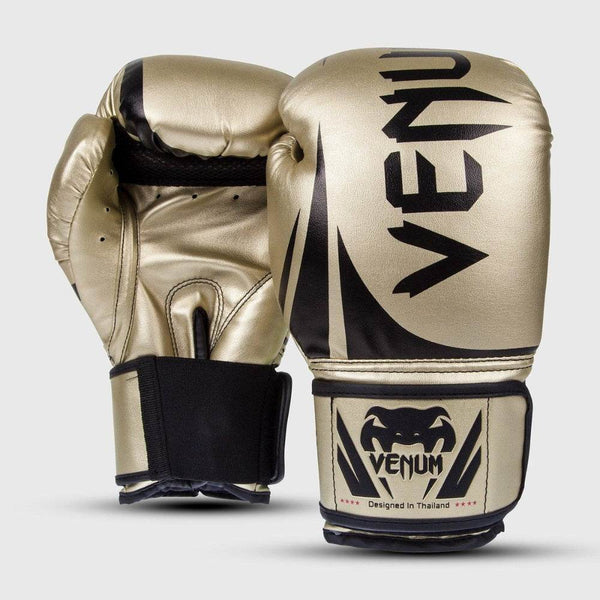 Front and back view of Venum Challenger 2.0 boxing gloves in gold with black accents, featuring the Venum logo on the striking surface and wrist strap.