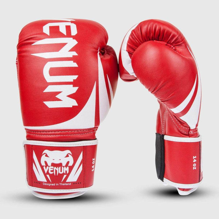 Side angle showing both gloves upright, one curled into a fist, with curved ergonomic design and bright white detailing.