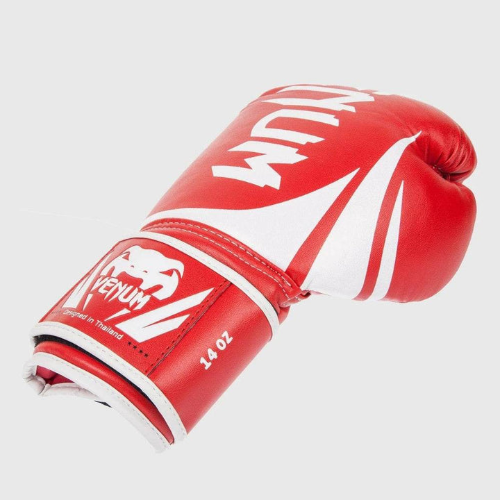 Angled close-up emphasizing the outer design, curved padding, and the branded Velcro strap with “Designed in Thailand” notation.