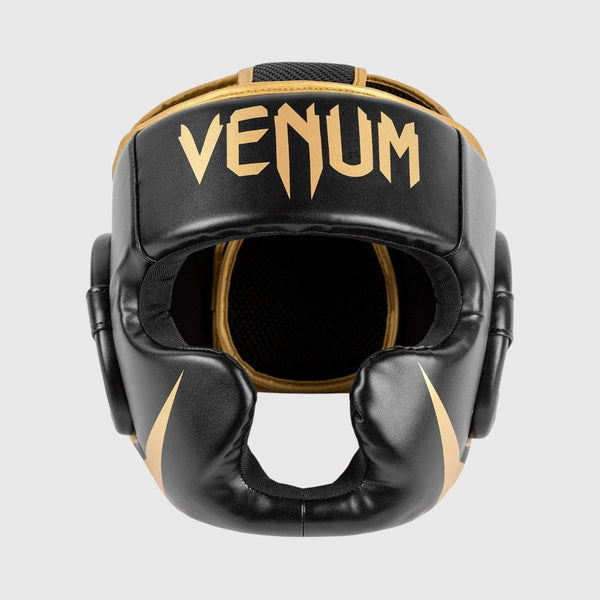 Front view of Venum headgear in black and gold colorway with large Venum logo on the forehead panel.