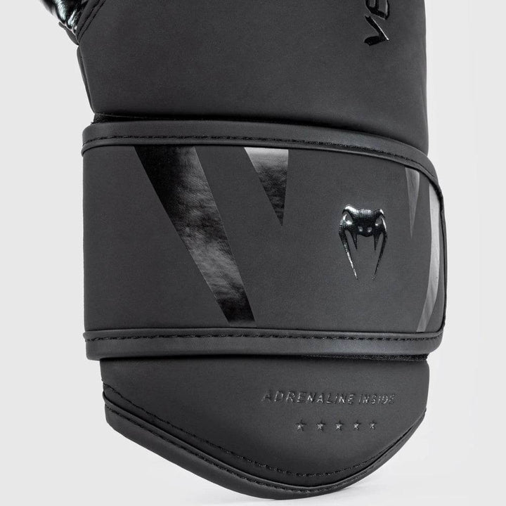 Close-up view of the wrist strap showing "Adrenaline Inside" text with reinforced stitching.