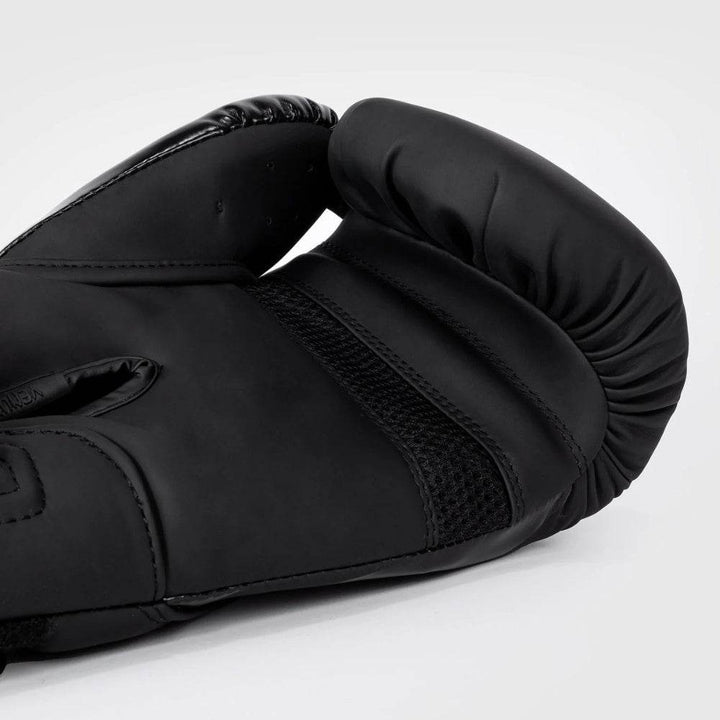 Glove laying flat to display the full palm, mesh panel, and internal padding designed for breathability and hand protection.