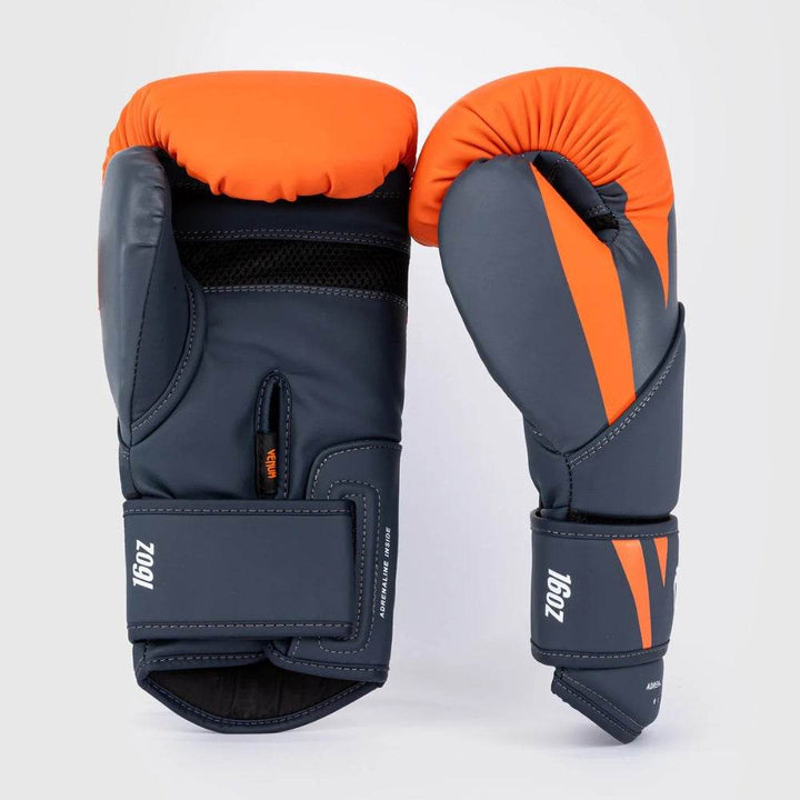 Left and right gloves side by side highlighting the 16oz label, mesh panel, and firm padding for wrist support.