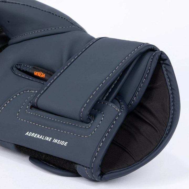 Close-up view of the wrist strap showing "Adrenaline Inside" text with reinforced stitching.