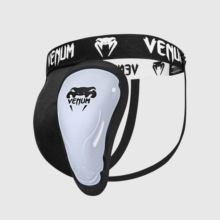 Black and white Venum athletic groinguard with a contoured protective cup attached to a branded elastic waistband.