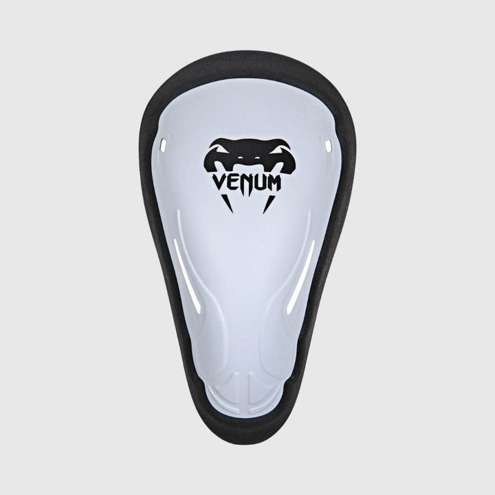 Front view of Venum white protective cup with black logo, designed for athletic groin protection.