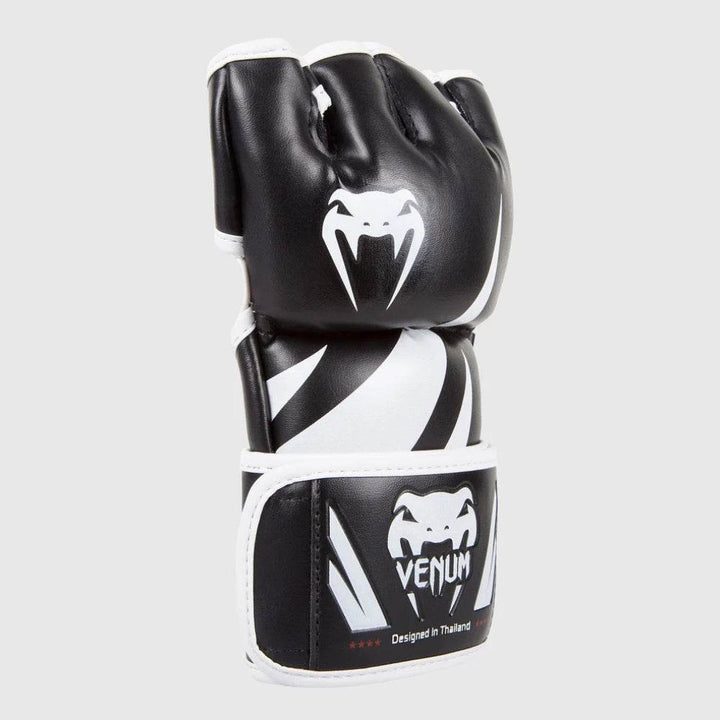 Side view showing aggressive knuckle padding and sharp contrast design.