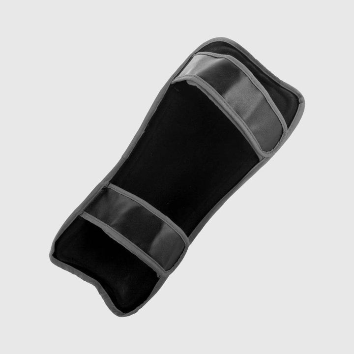 Interior view of a Venum challenger shin guard showing soft inner padding and two black adjustable hook-and-loop closure straps.