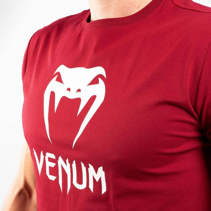 Close-up of the chest area, focusing on the large white printed Venum logo.