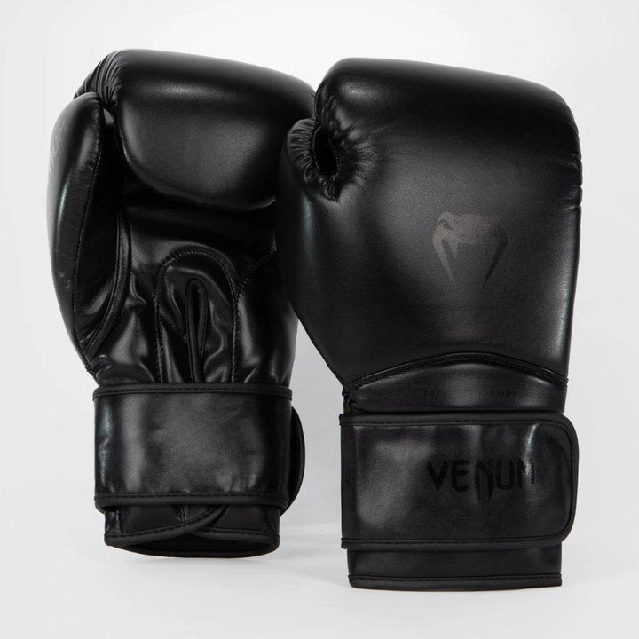Front and back view of Venum Contender 1.5 boxing gloves in solid black with tonal branding including the snakehead logo and Venum text subtly embedded on the surface.