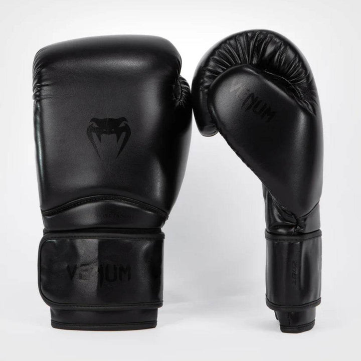 Paired front and angled side view highlighting the stealth all-black aesthetic with black-on-black design elements and a glossy finish.