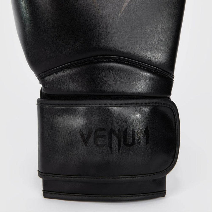 Detailed close-up of the wrist area showing subtle tonal “VENUM” branding and hook-and-loop strap system for secure closure.