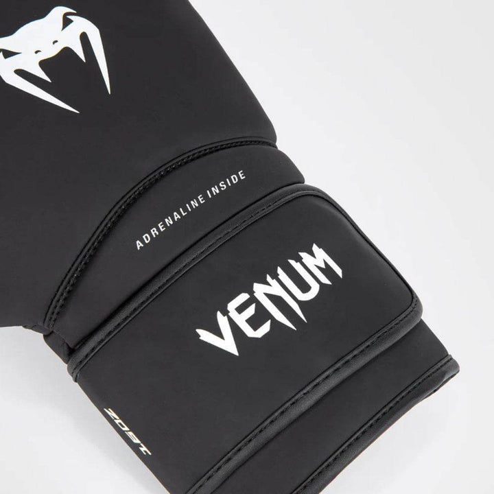 Close-up of the wrist section with bold white "ADRENALINE INSIDE" and “VENUM” text branding, hook-and-loop strap, and 12oz weight marking.