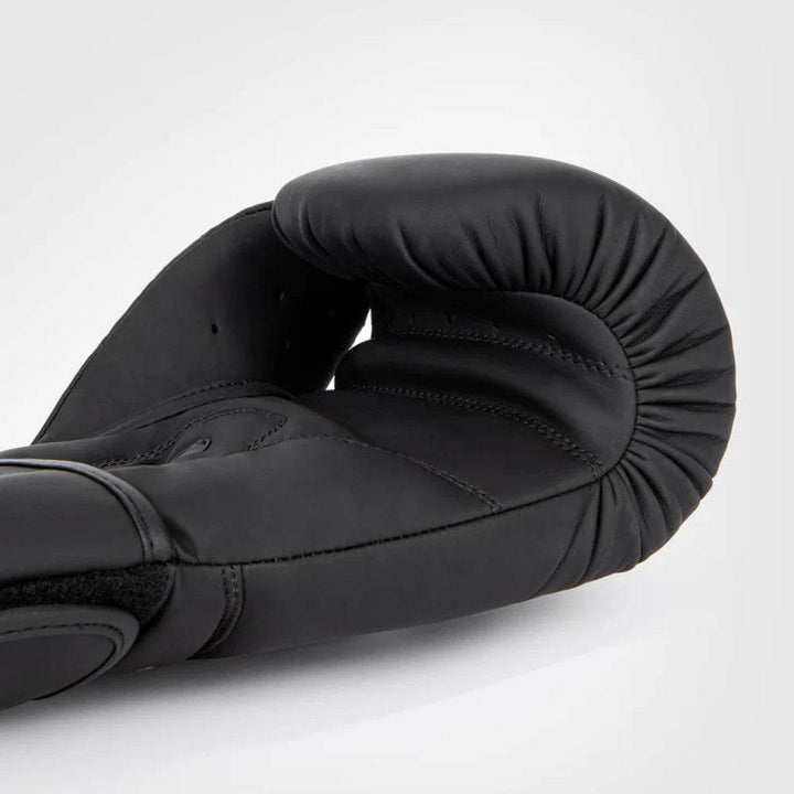 Interior palm view highlighting ventilation holes, finger contour stitching, and breathable mesh fabric for comfort.