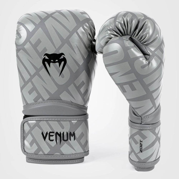 Front and side angled view of grey/black Venum Contender 1.5XT gloves highlighting the bold print design and curved padding on the palm side.