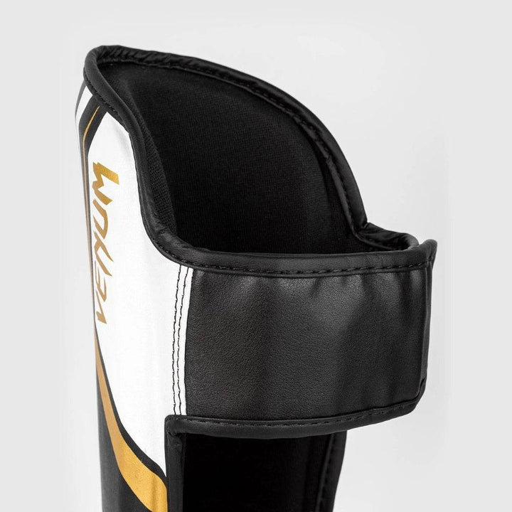 Back strap close-up of the Venum Contender 2.0 shinguards showing the secure hook-and-loop fastening system in black PU leather.