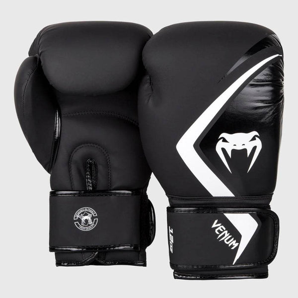Front and back view of Venum Contender 2.0 boxing gloves in matte black with a bold white Venum snakehead logo and diagonal graphic stripe on the striking surface.